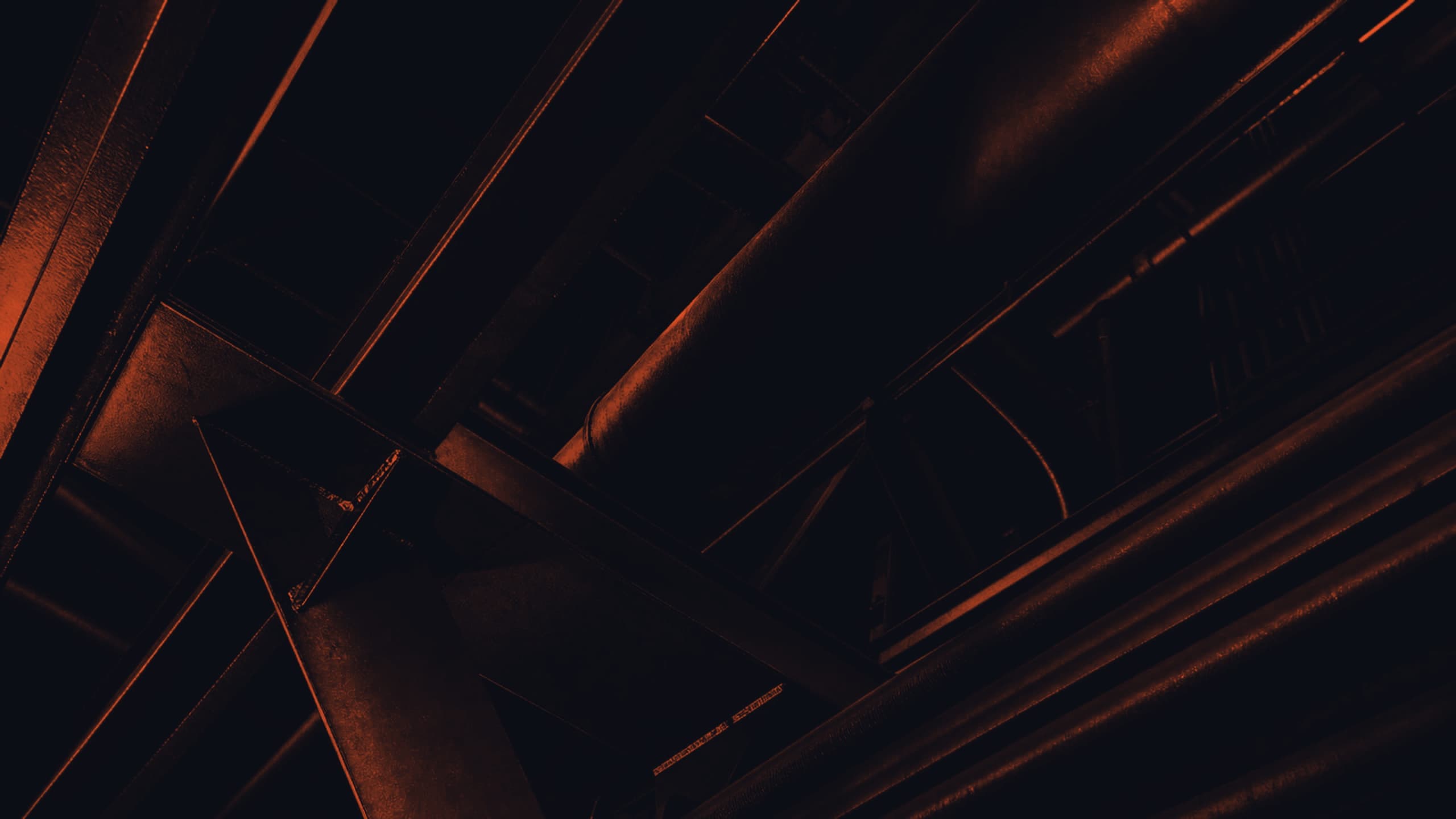 Industrial infrastructure illuminated beneath a night sky